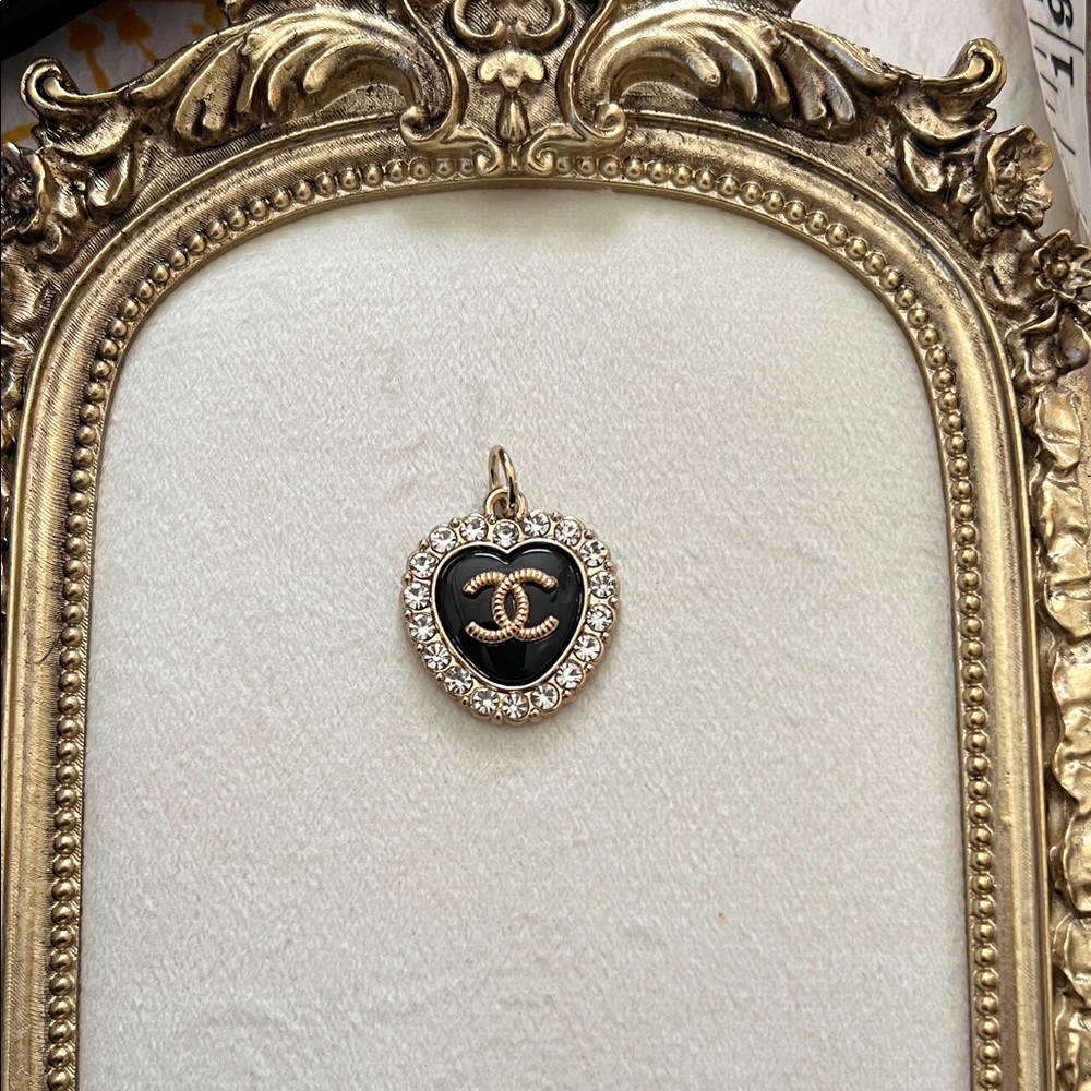 CHANEL Black and Gold Heart Pendant with Crystals